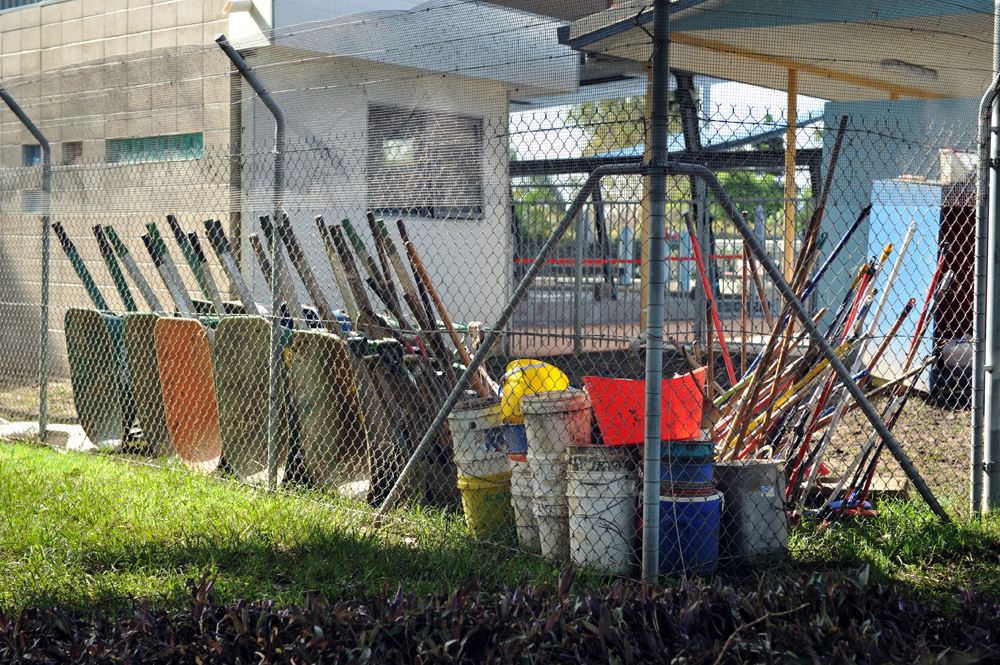 Cleaning tools are left to dry after cleaning the local swimming pool in Goodna, Queensland.