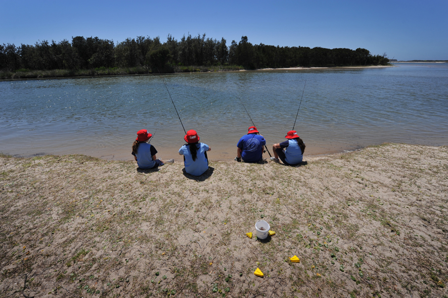 Children learn to fish in Lake Illawarra as part of their school curriculum.